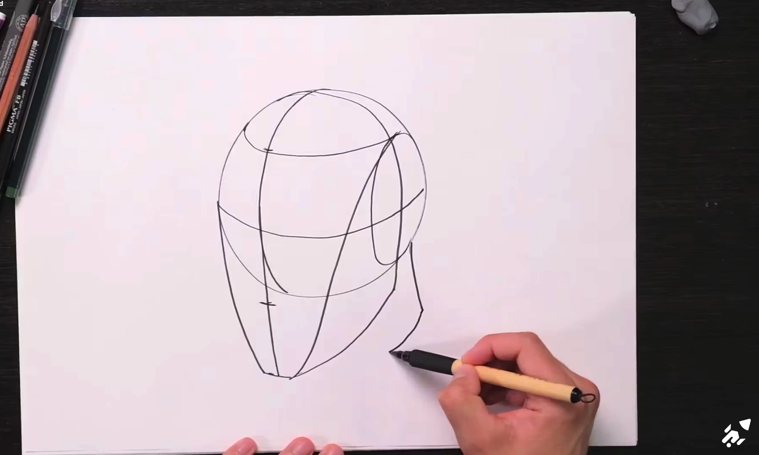 Dessine une tête simplifiée selon la méthode Loomis.